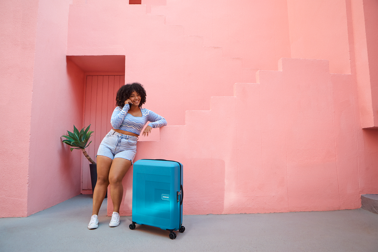 american tourister with luggage