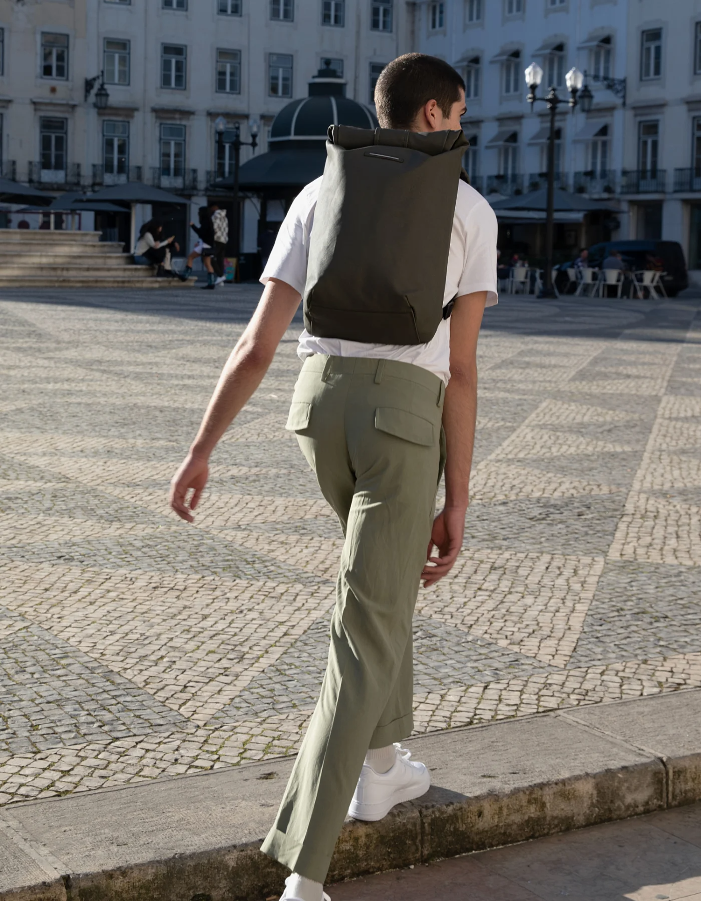 wearing backpack around town